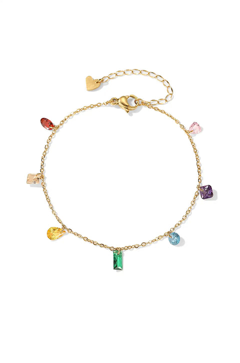 This rainbow gem bracelet features a gold chain with colorful gemstone charms.