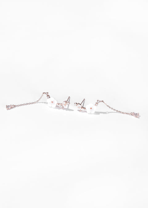 Vine earrings featuring flower design with crystal details and long chain.