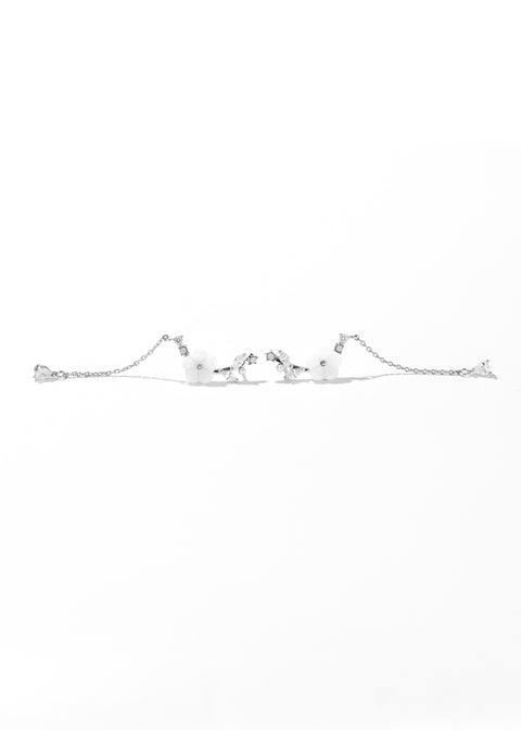 Vine earrings featuring flower design with crystal details and long chain.
