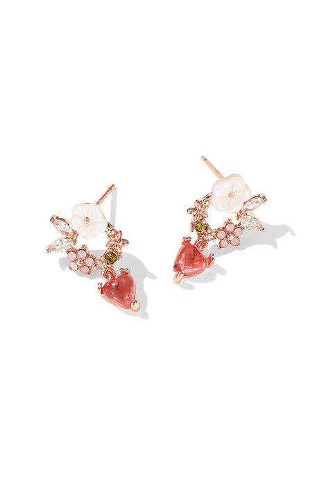 Floral heart earrings with white flower petals, and small crystals.