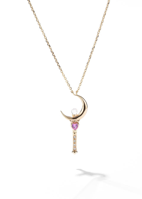 This sailor moon necklace has a pendant with a crystal orb hanging from a gold chain.