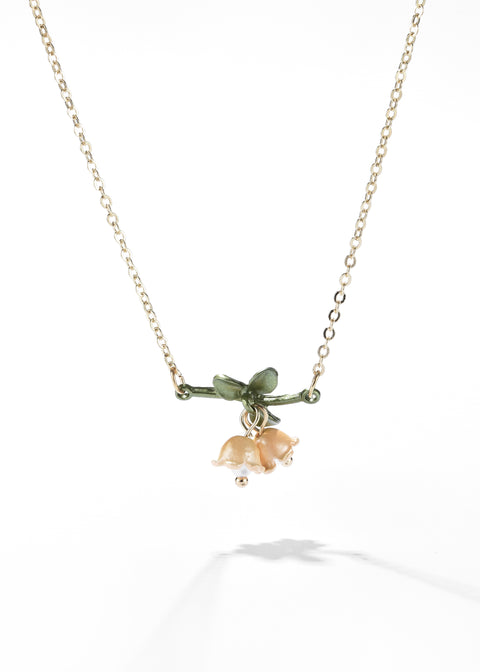 Lily of the valley necklace with a gold-tone chain.