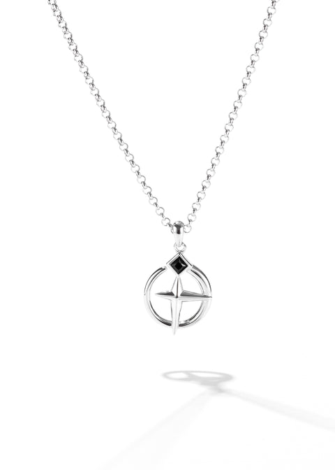 One of the matching couples necklaces with a silver cross pendant featuring a black diamond-shaped stone at the intersection of its cross design.