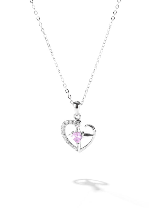 One of the matching couples necklaces with a silver cross pendant that has a smaller pink stone in the center and part of the heart outlined with tiny crystals.