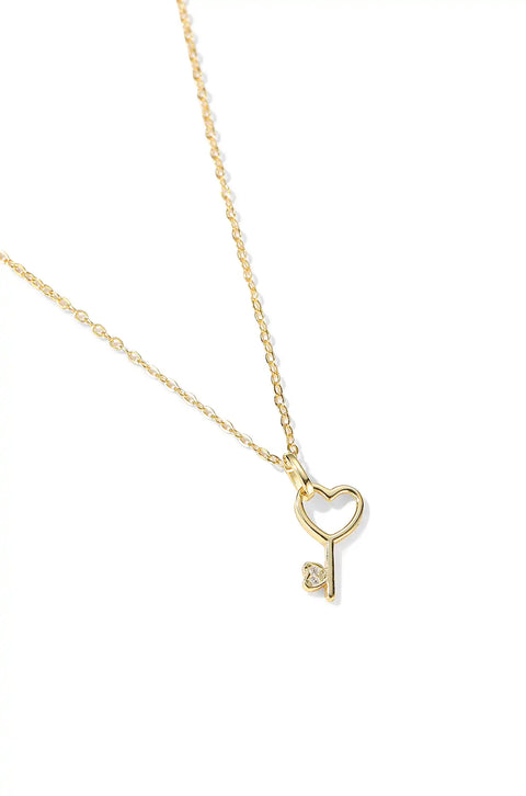 A heart key necklace in a golden chain.