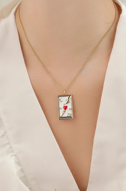 A tarot card necklace featuring a rectangular pendant inscribed at the bottom.A tarot card necklace featuring a rectangular pendant inscribed at the bottom.