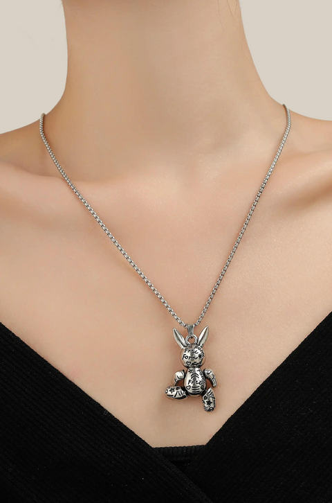A rabbit necklace with a textured, silver rabbit pendant hanging on a slender chain.