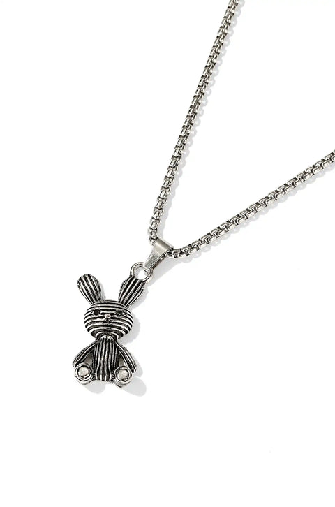 A care bear necklace with a silver chain and a detailed bunny pendant.