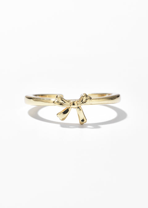 A thin gold ring with a love knot ring design.