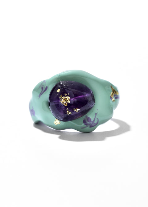 Artisan Rings accented by swirls and gold embellishments.