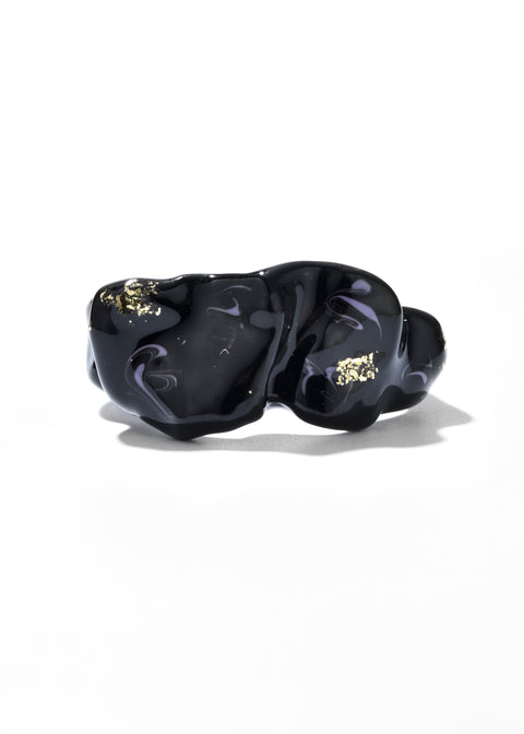 Artisan Rings accented by swirls and gold embellishments.