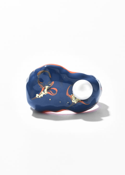 Artisan Rings accented by swirls and gold embellishments.