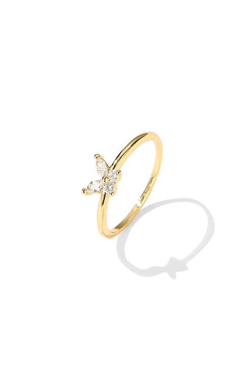 A butterfly mood ring with a gold band centered by round stone.