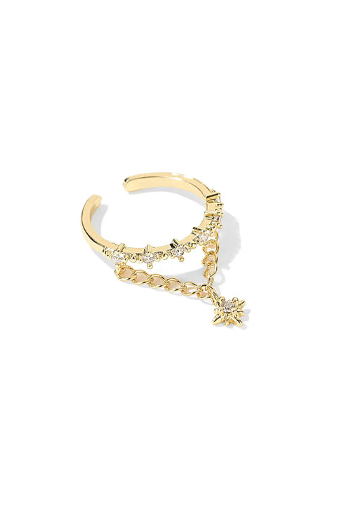 A gold celestial ring featuring a chain and a star charm.