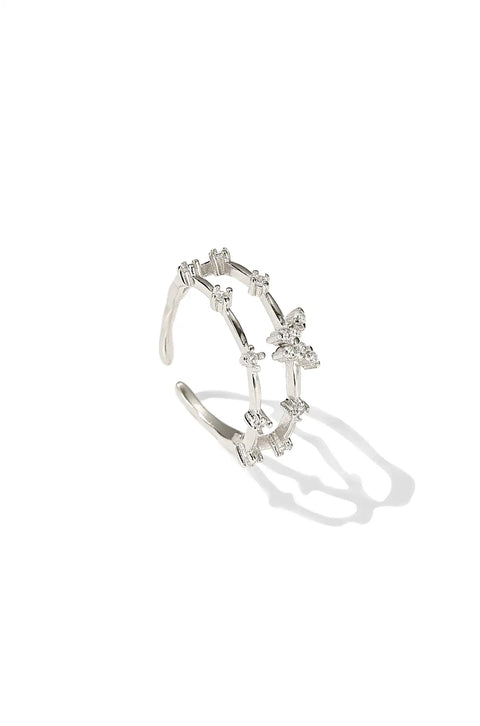 A sterling silver butterfly ring with butterfly motif accented by small stones.