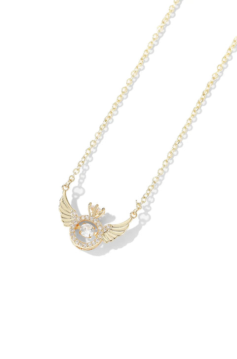 An angel wing necklace featuring central, sparkling gem surrounded by smaller crystals.