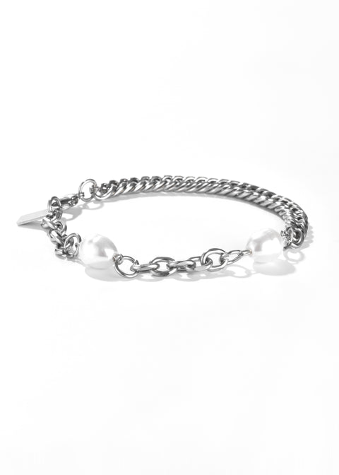 A chain bracelet, with two white pearls on sides and a toggle clasp.
