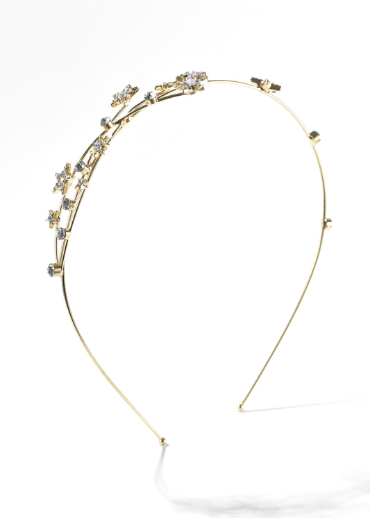 A star headband with small, sparkling stars and clear crystals.