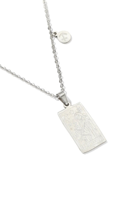 A Sagittarius necklace featuring rectangular pendant with floral design, and a smaller, round charm with the zodiac sign.