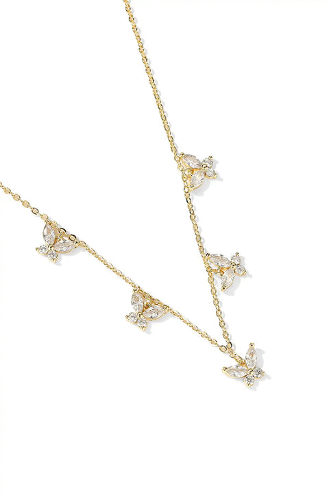 A crystal butterfly necklace with butterfly pendants set on a chain.