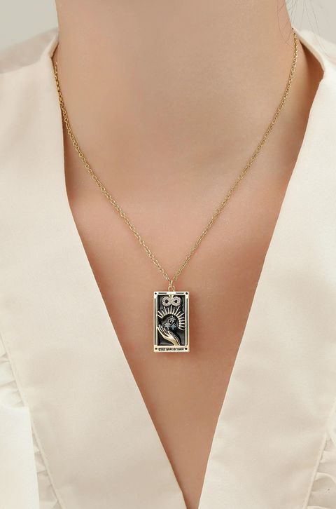 A tarot card necklace featuring a rectangular pendant inscribed at the bottom.