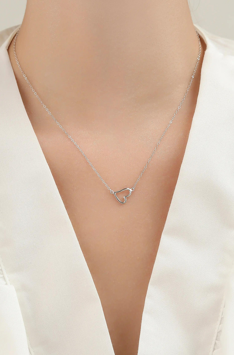 A floating heart necklace with a distinct heart pendant on a simple chain.