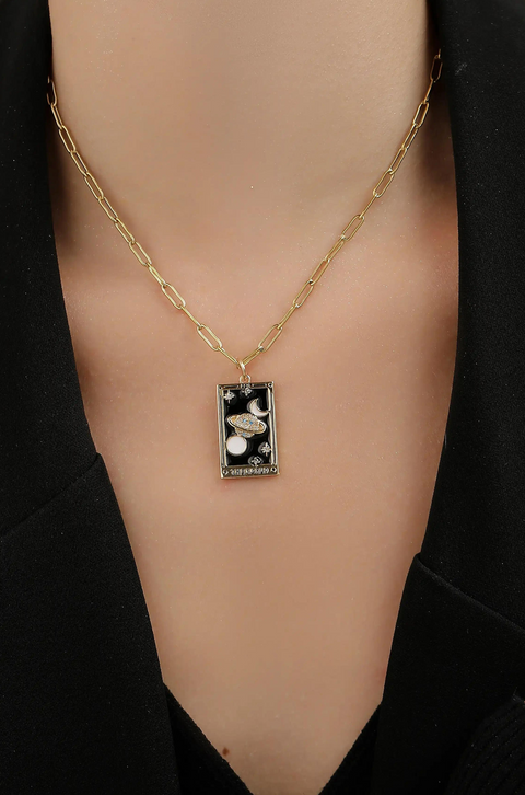 A tarot card necklace featuring a rectangular pendant inscribed at the bottom.