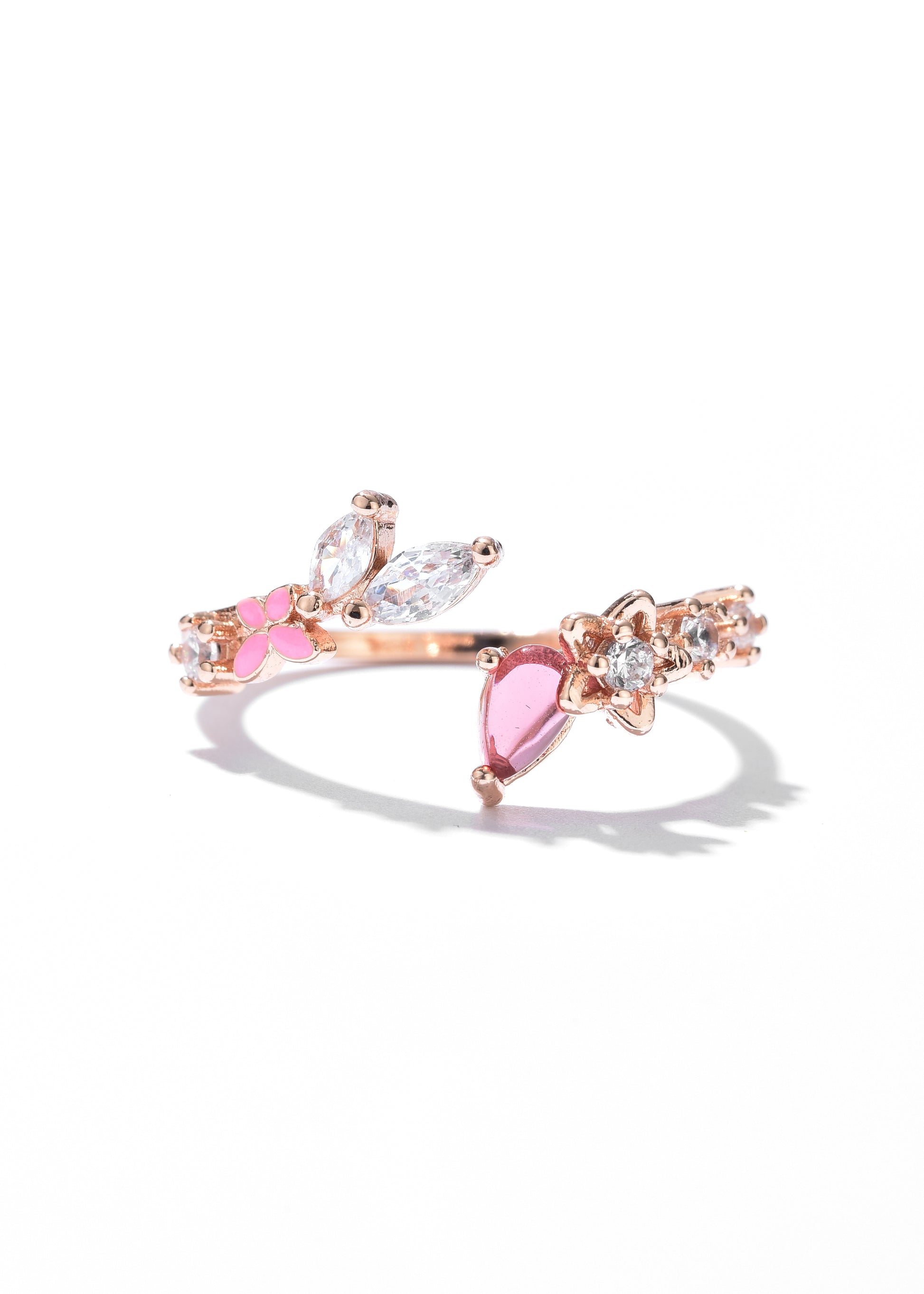 A flower ring with a butterfly design in mid-flight, adorned with pink and clear crystal set along the ring's band.