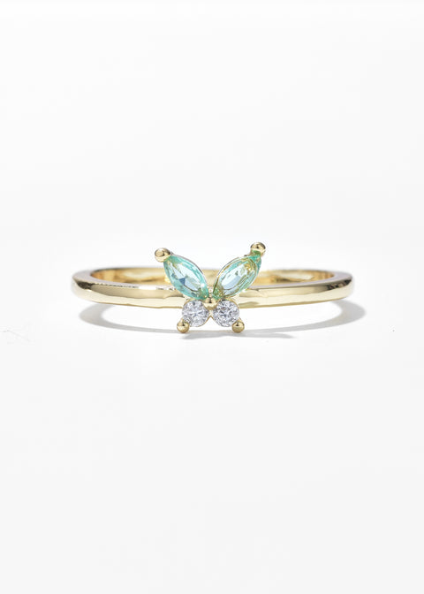 A butterfly mood ring with a gold band centered by round stone.