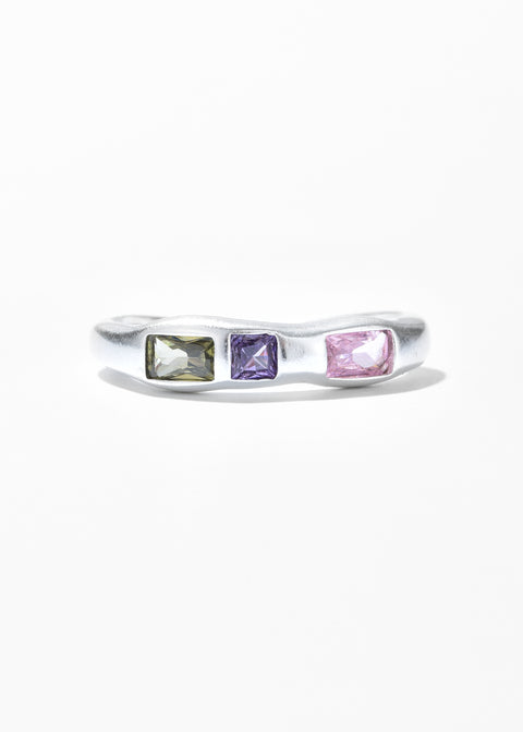 An adjustable ring with a clear gemstones in various hues and cuts.