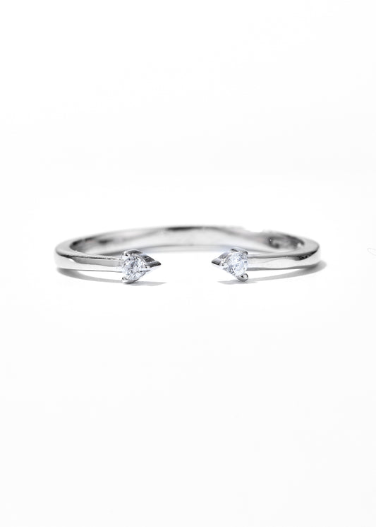 An adjustable ring with open ring design, and has a single diamond set at each tip.