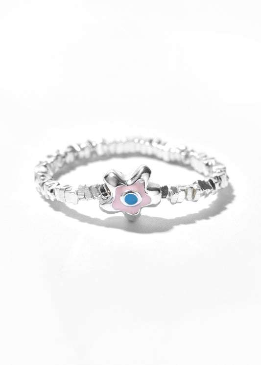 A silver eye ring with a flower-shaped charm that has a pink outline and a blue center.