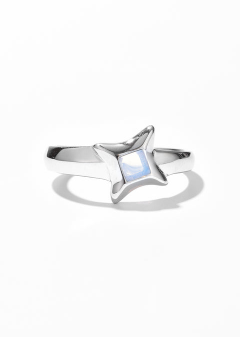 One of the couple rings set, in a star ring design with blue gem at the center.