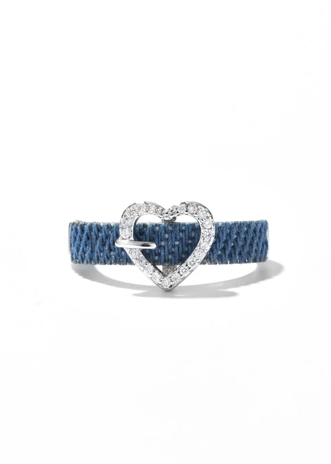 A heart shaped ring with a denim band setting encrusted with sparkling small stones.