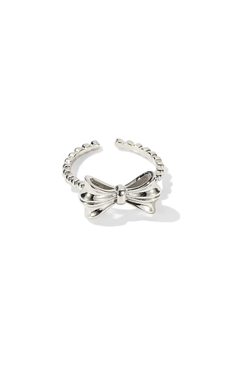 Bow Ring with a split shank, crafted in a shiny, metallic finish.