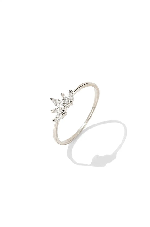 A crown ring with pointed, sparkling marquise-cut stones on top.