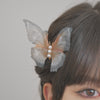 Butterfly Barrette with translucent wings and white pearls centerpiece.