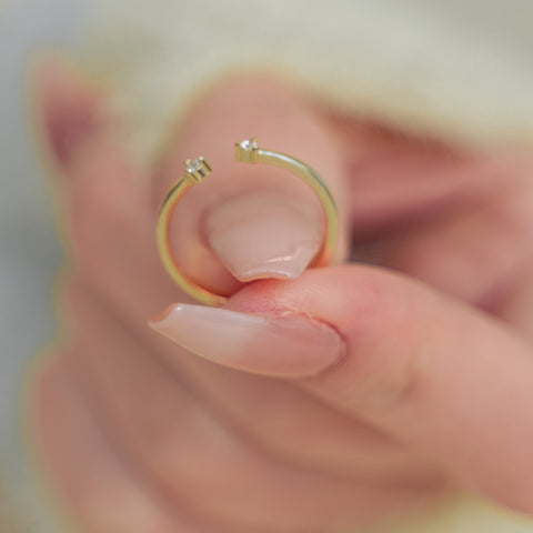 Double Heart Sparkling Ring with open design, and diamond set at each tip.