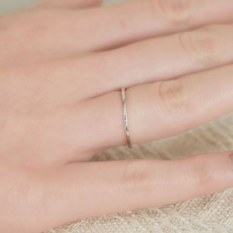 A gold band ring design with sleek, shiny finish.