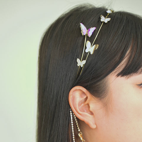 Butterfly chain headband designed with crystals, small stones, and chain links.