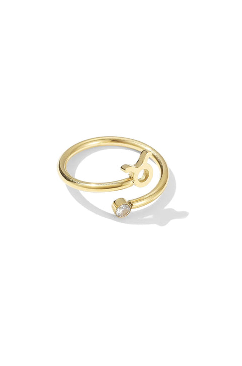 A gold Taurus ring with the zodiac's symbol and a single crystal embellishment.