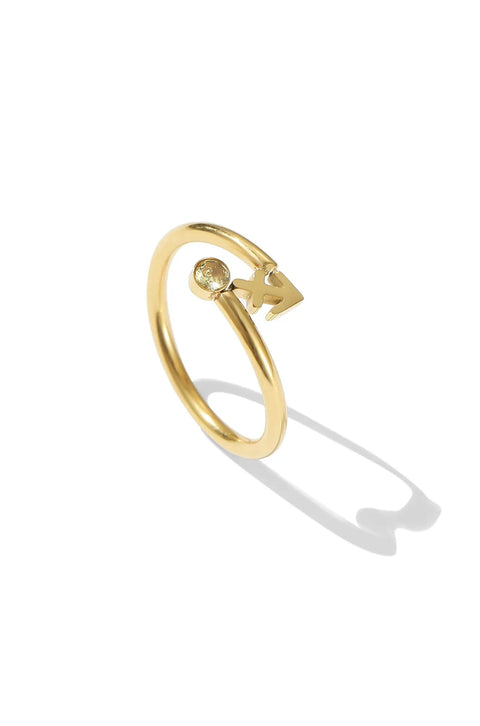 A Sagittarius ring with a single, clear gemstone at the intersection of the arrow's shaft and head.